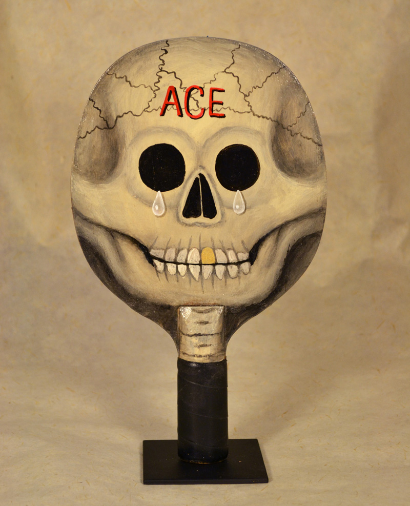 Fred Stonehouse, Skull paddle (ACE), 2018, acrylic on vintage ping-pong paddle. 26×16,5 cm